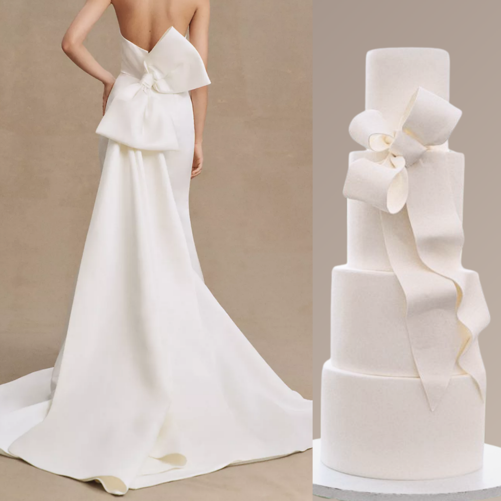 On the left side of the image is a back view of a woman wearing an elegant, strapless white wedding gown. The gown features a sculptural, asymmetrical bow at the lower back, with flowing fabric that cascades into a long, smooth train. The material is sleek and structured, giving a refined, sophisticated look.

On the right side of the image is a four-tier white wedding cake designed to resemble the dress. The cake is adorned with an intricate, large bow made of fondant, mimicking the gown's bow detail. The tiers are smooth and rounded, showcasing a minimalist yet artistic design that mirrors the dress's elegance. The cake and the dress together create a cohesive, luxurious theme that is both modern and timeless.