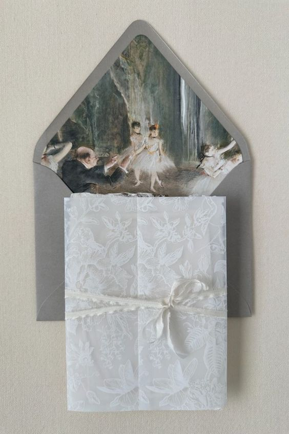 Elegant wedding invitation with a lace-embossed white cover, tied with a delicate string. The envelope features a vintage painting of ballet dancers performing, adding a touch of artistic romance to the design.