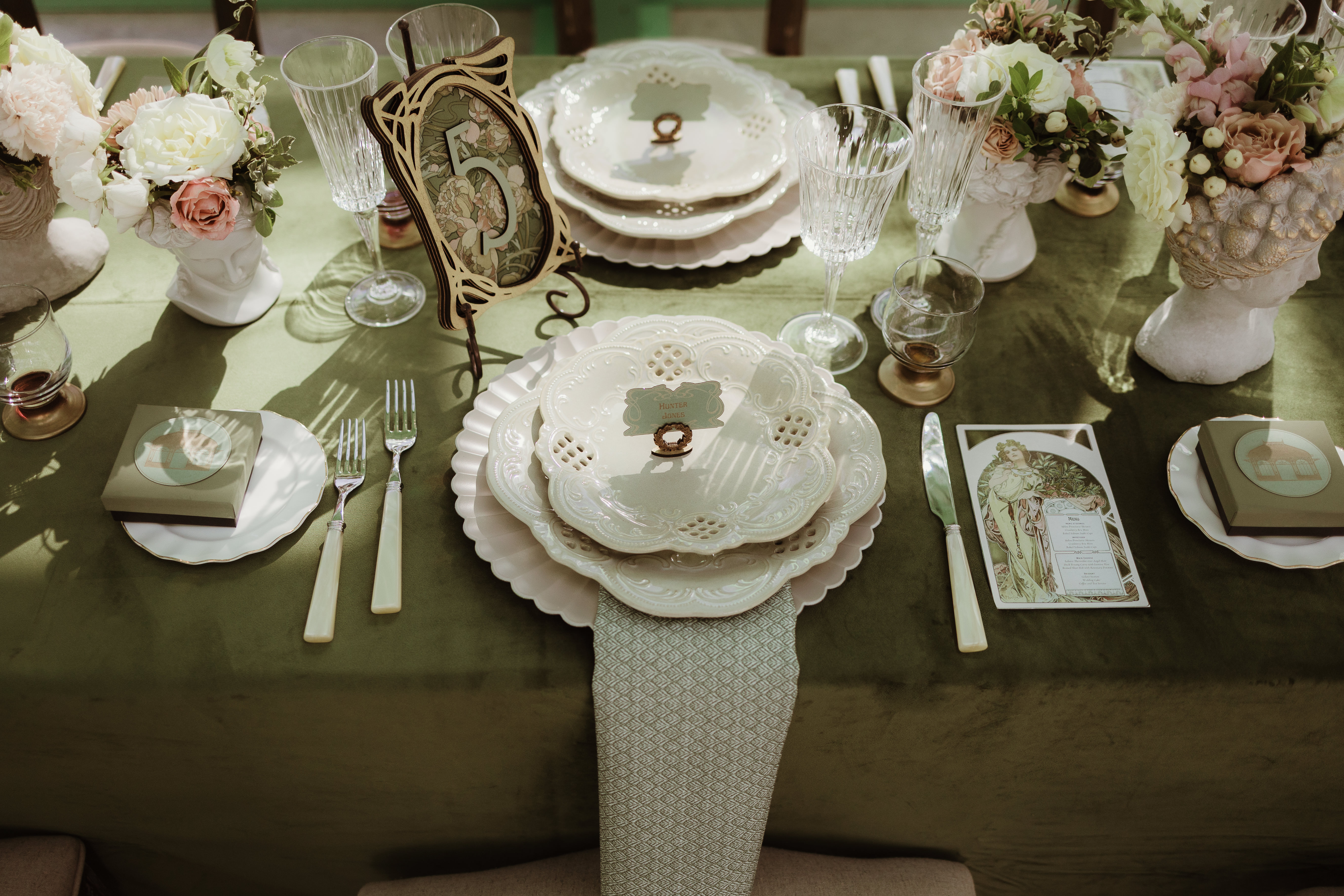 Art Nouveau wedding tablescape with vintage china, velvet linens, and floral centerpieces inside L’Orangerie in Greenville, NY