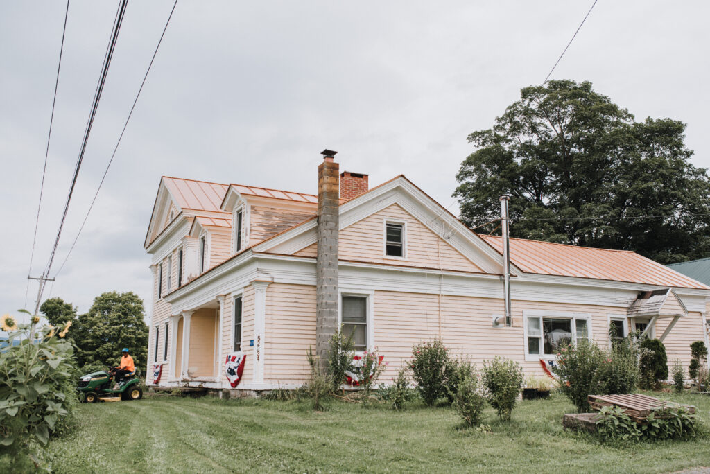 Yellow farmhouse at East Branch Farms in Roxbury, NY