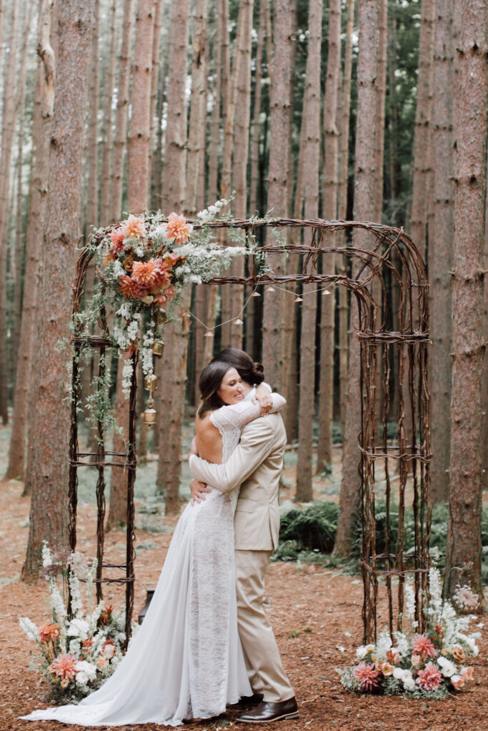 A bride and Groom embrace at their Roxbury Barn and Estate wedding
